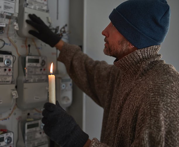 Olathe, KS homeowner checking the electric meter during a power outage