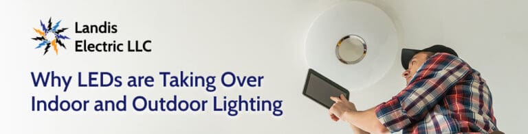electrician looking at LED light fixture