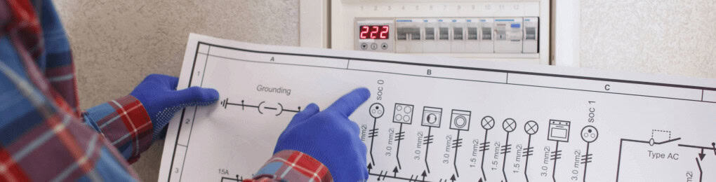 electrician looking at drawing of apartment wiring